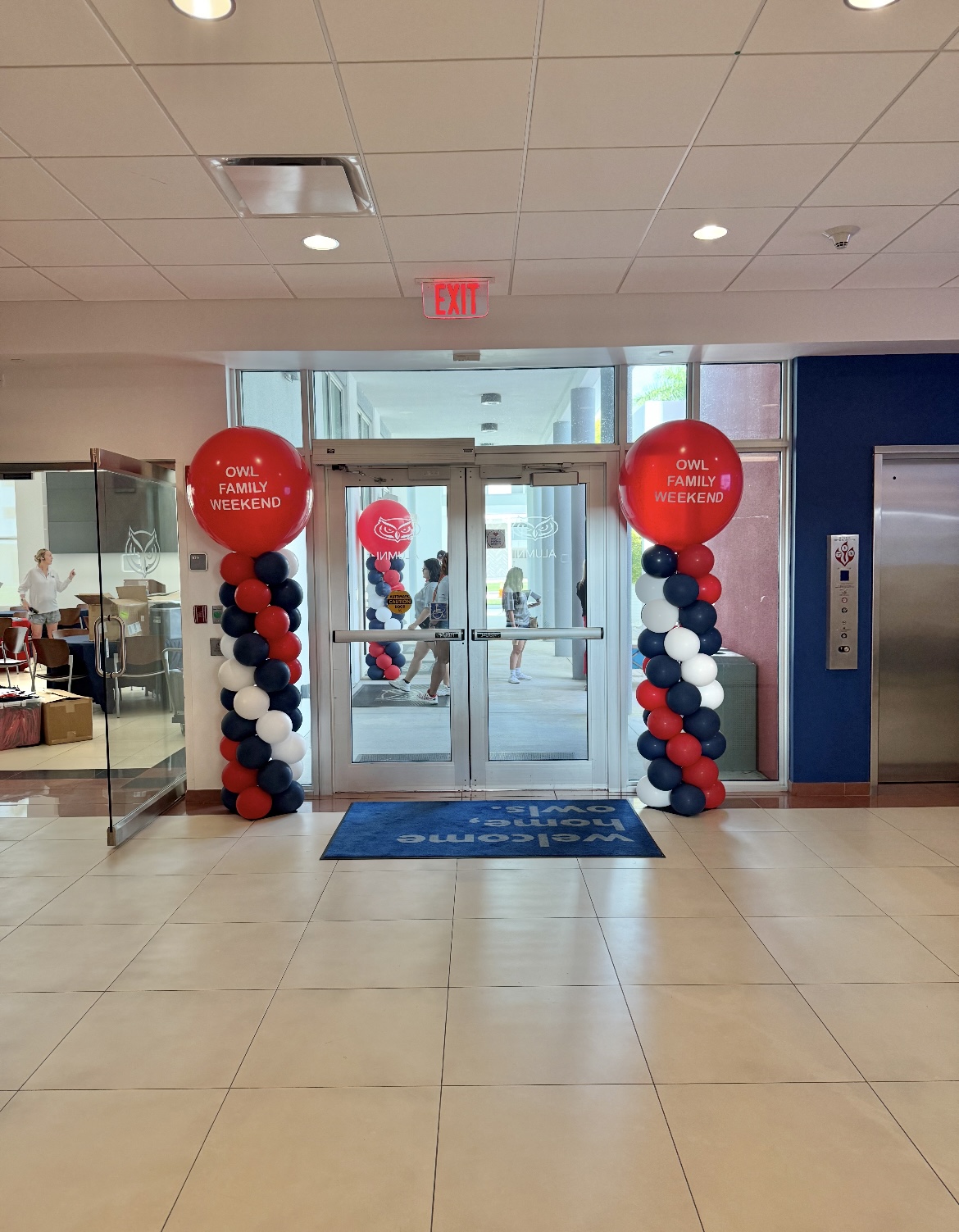 Branded balloon columns for a university event by The Event Edit
