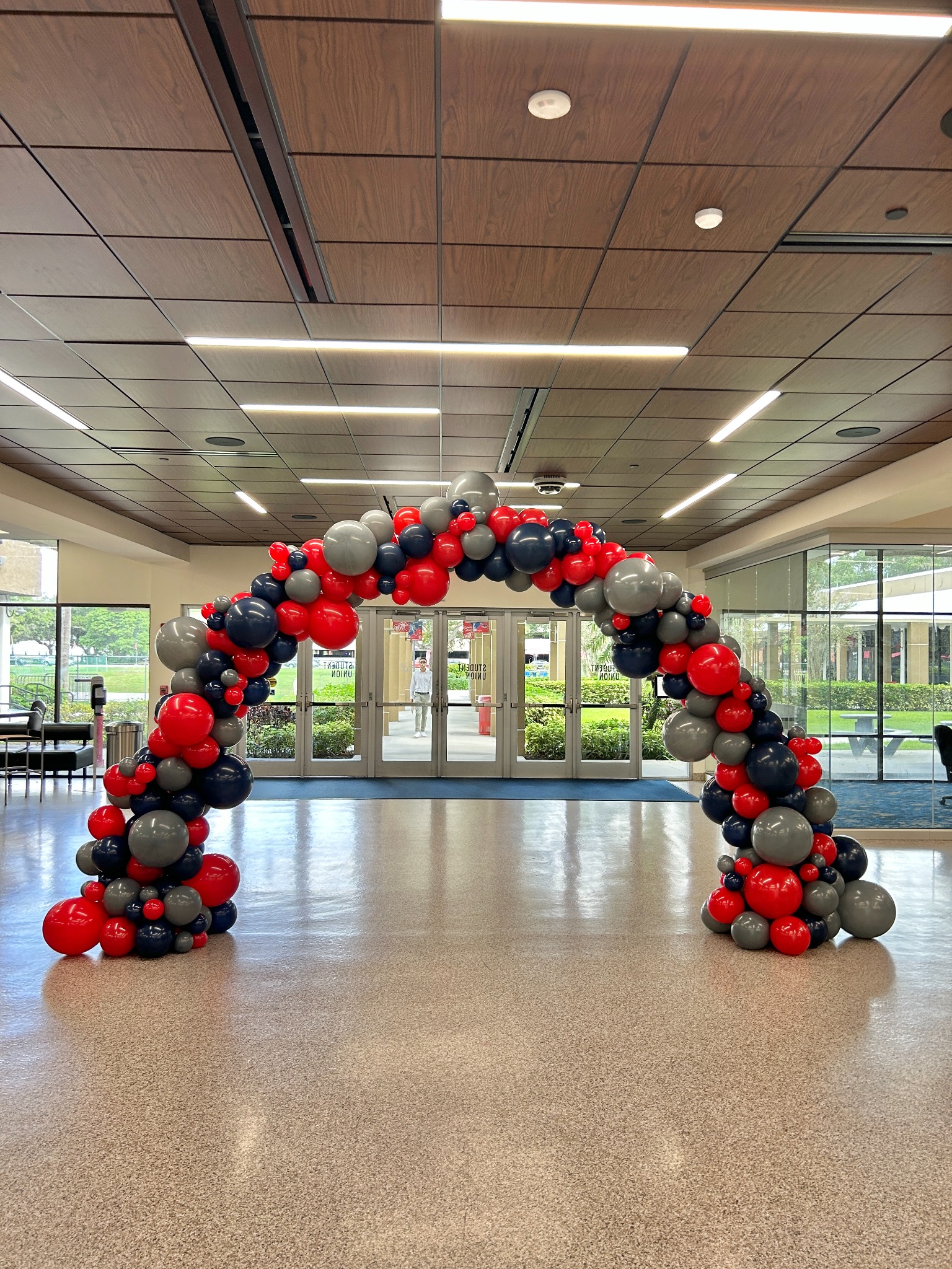 Organic corporate balloon arch by The Event Edit